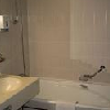Fürdőszoba a négycsillagos Termál Hotel Héliában Budapesten