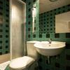 Európa apartman fürdőszobája Budapesten zöldövezetben a II. kerületben a Budakeszi úton - Hotel Európa